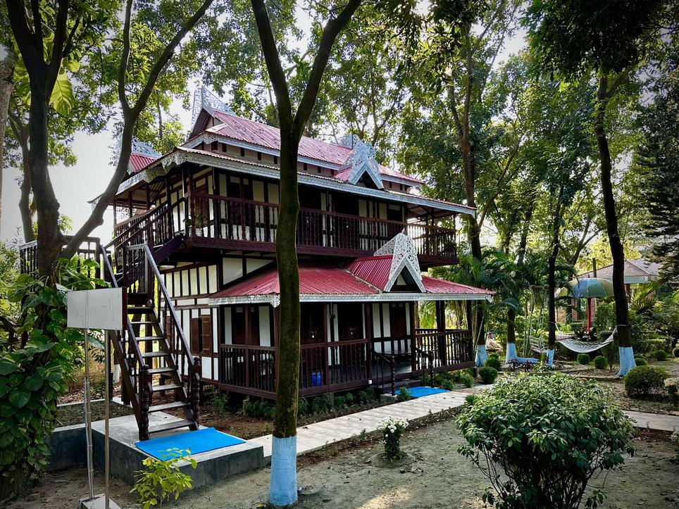 A picturesque Japanese cottage with a red roof and a balcony, situated in Dhaka hotel, Barnochata resort in Savar,